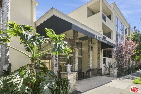 Front view of a multi-story building with a covered entrance labeled 'Villa Montana'.