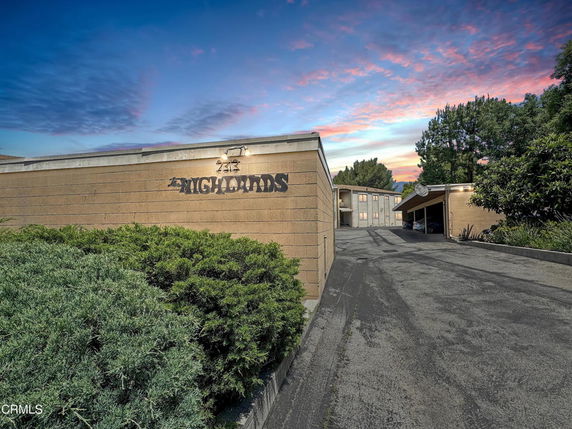 Front view of a building with a sign labeled 'HIGHANDS'.
