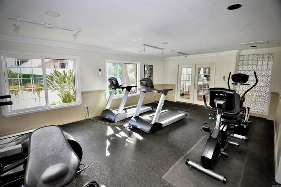 Indoor gym area with treadmills and exercise equipment.