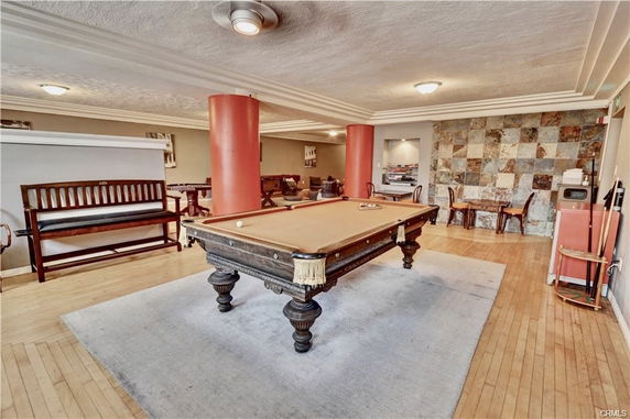 Indoor clubhouse area with a pool table and seating.