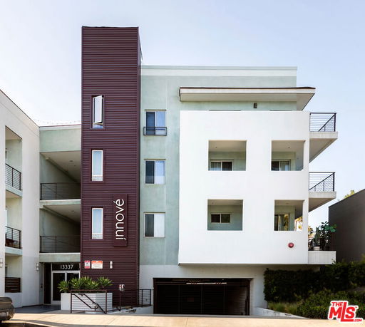 Front view of a modern multi-story apartment building