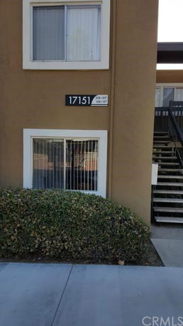 Exterior view of a building with apartment number 17151 displayed.