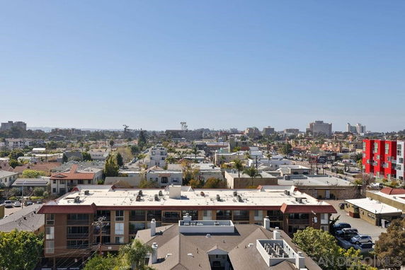 View of a residential and commercial area with various buildings and structures.