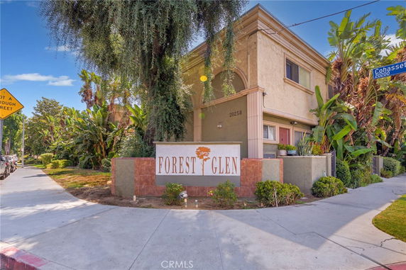 Front view of a two-story building with the sign 'Forest Glen'.