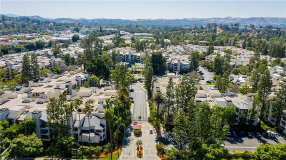Panoramic view of a residential area with multiple apartment buildings surrounded by trees.