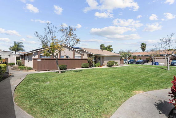 Front view of a single-story house with a lawn