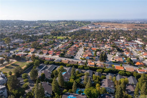Panoramic view of a suburban area with numerous houses and a sprawling landscape.