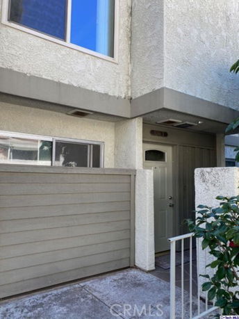 Front view of a townhouse with a small entrance area.