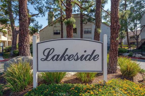Front view of a residential building with a sign reading 'Lakeside' in front.