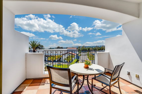 Balcony view overlooking surrounding buildings and landscape