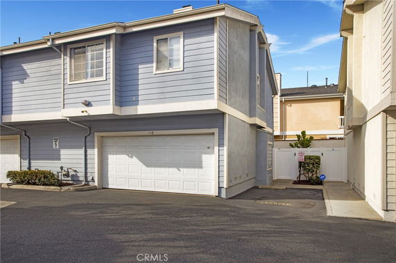 Front view of a two-story house with a garage.