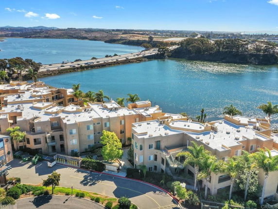 Elevated view of a series of apartment buildings located near a body of water.