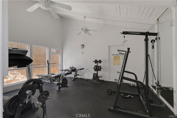 Indoor fitness area with exercise equipment.