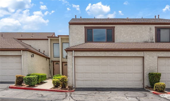 Front view of a two-story house with a double garage.