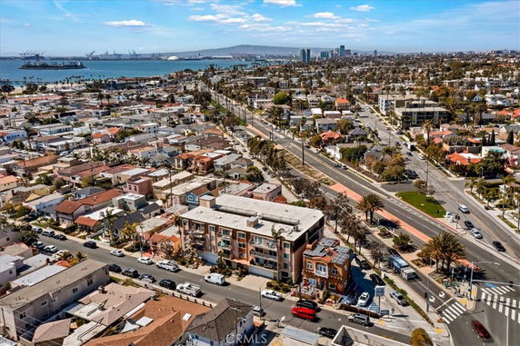 Wide angle view of a coastal urban area with multiple buildings and roads.