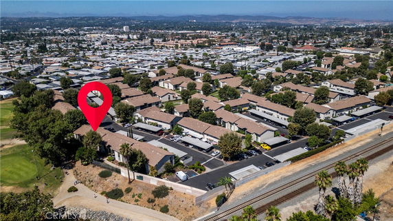 Aerial view of a residential area with multiple buildings and roads.