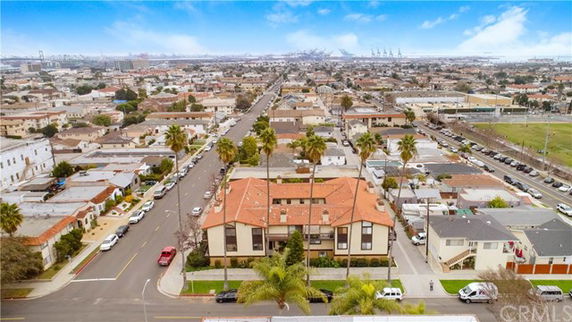 Panoramic view of a neighborhood with multiple residential buildings and streets.