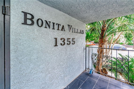 Front view of a building with the name 'Bonita Villas' and the number '1355' on the wall.