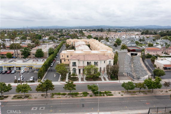 Aerial view of a residential area with multiple buildings and surrounding streets.
