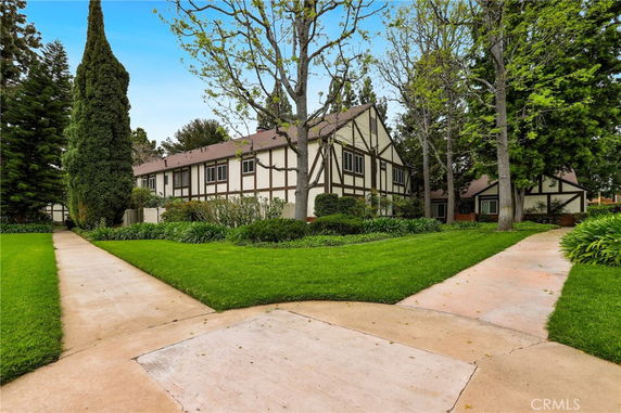 Front view of a two-story house with Tudor-style architecture.