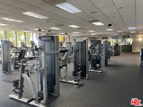 Interior view of a gym area with exercise machines.