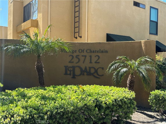 Front view of a building with visible address and name signage.