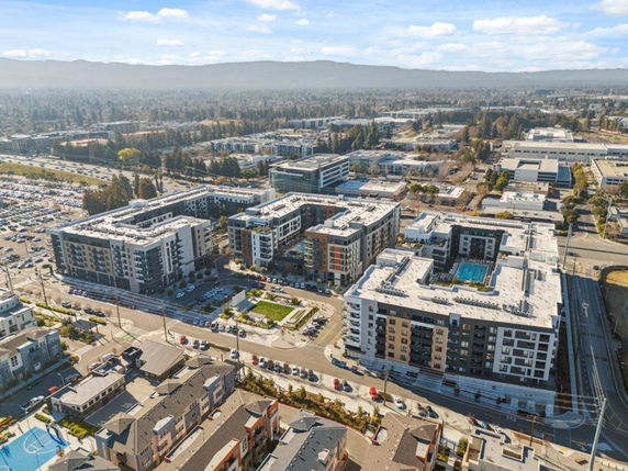 Aerial view of multiple apartment complexes in an urban area.