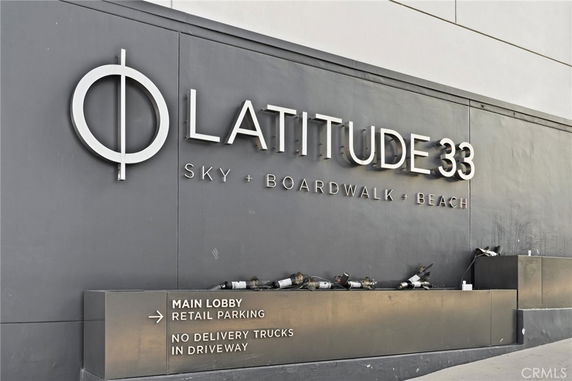 Front view of a building with 'Latitude 33' signage.