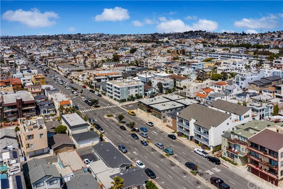 Aerial view of a residential neighborhood with multiple buildings and streets.