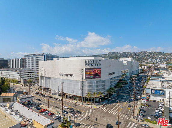 Front view of a large shopping center with a prominent facade.
