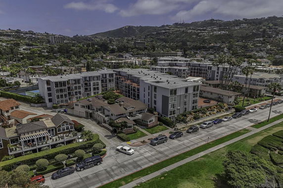 Aerial view of a residential area with multi-story buildings and houses.