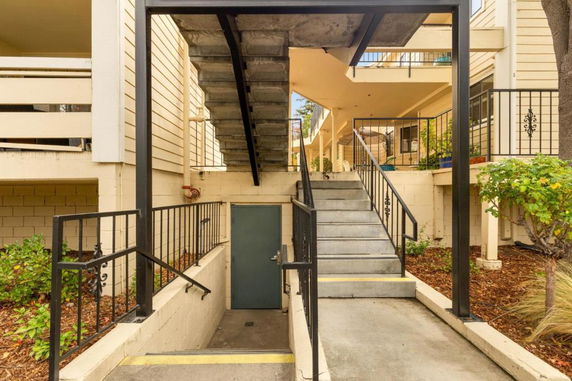 Exterior view of staircases and walkways in a multi-level building.