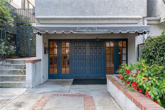 Front view of a building entrance with double doors and an awning labeled 'Lindley Terrace'.