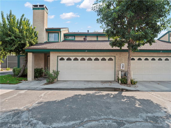 Front view of a two-story house with a double garage.