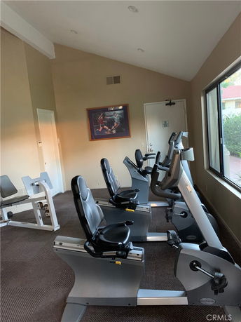 Indoor gym area with exercise bikes and fitness equipment.