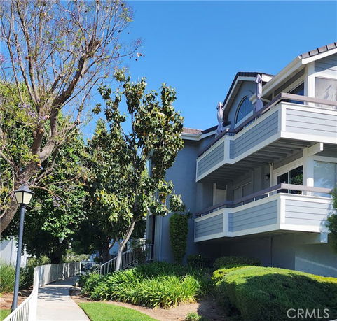 Front view of a residential building with balconies.