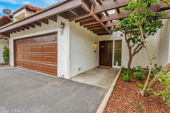 Front view of a house with a garage and entrance.