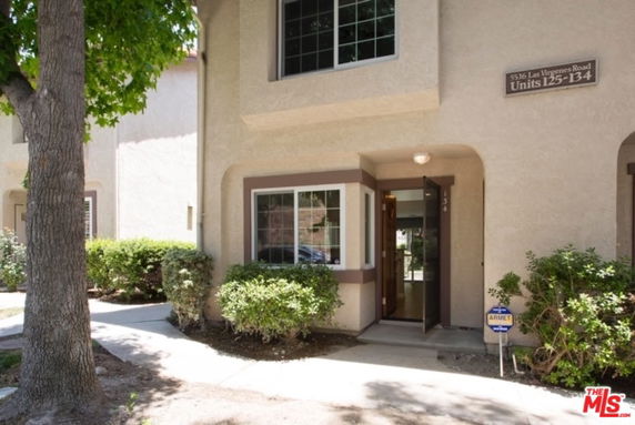 Front view of a condominium unit with an entrance door.