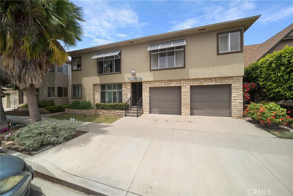 Front view of a two-story house with a double garage.