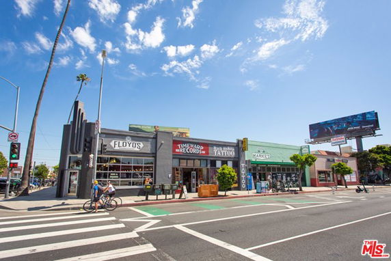 Front view of a single-story commercial building with multiple shops.