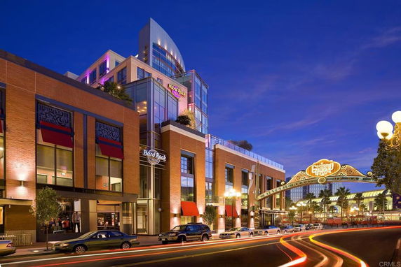 Front view of a multi-story hotel building with modern architecture and glass elements.