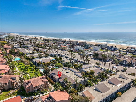 Panoramic view of a coastal residential area near the beach.