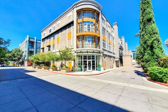 Front view of a multi-story building with modern architectural design.