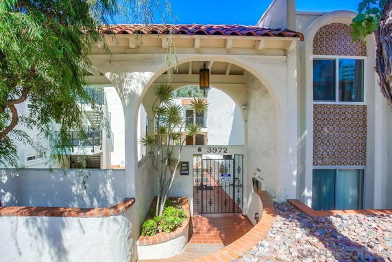 Front view of a house with an arched entrance.