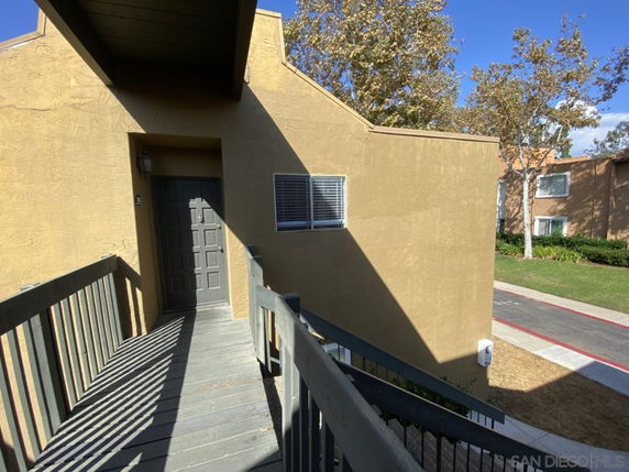 Front view of a building entrance with a walkway leading to the door.