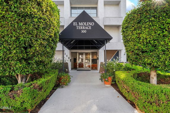Front view of a building entrance with signage 'El Molino Terrace 300'.