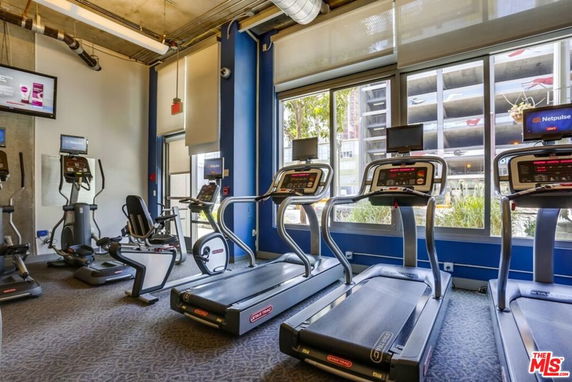 Indoor fitness area with treadmills and exercise equipment.