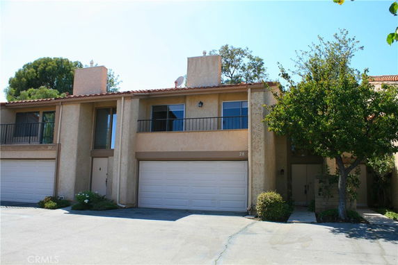 Front view of a two-story house with a double garage