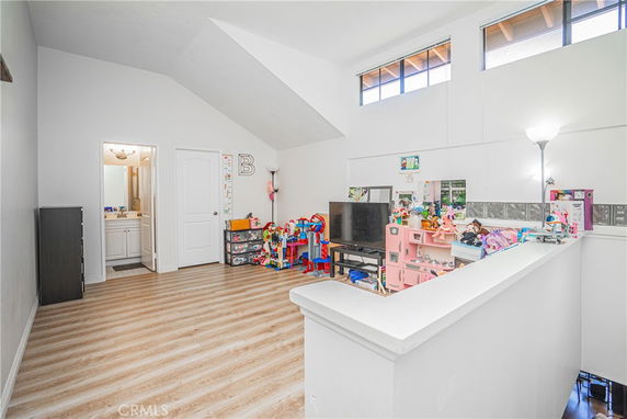 Indoor play area with toys and a small entertainment setup