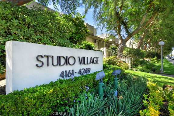 Front view of a building with a sign labeled Studio Village.